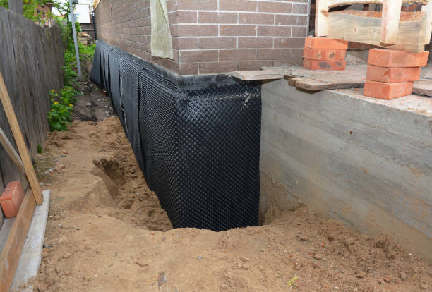 Happy homeowners after waterproofing job in Monmouth Beach